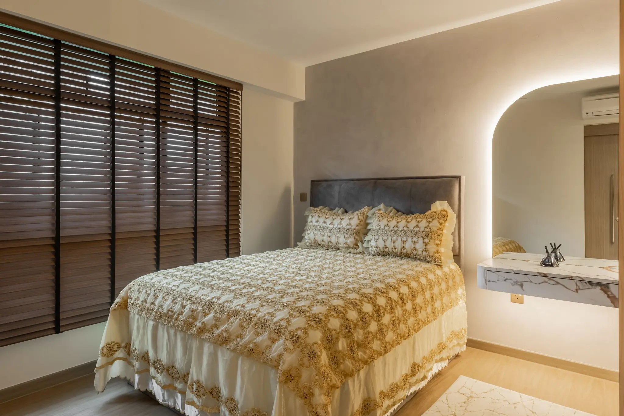 Bedroom with arched mirror and wood blinds at 125A Tengah Drive