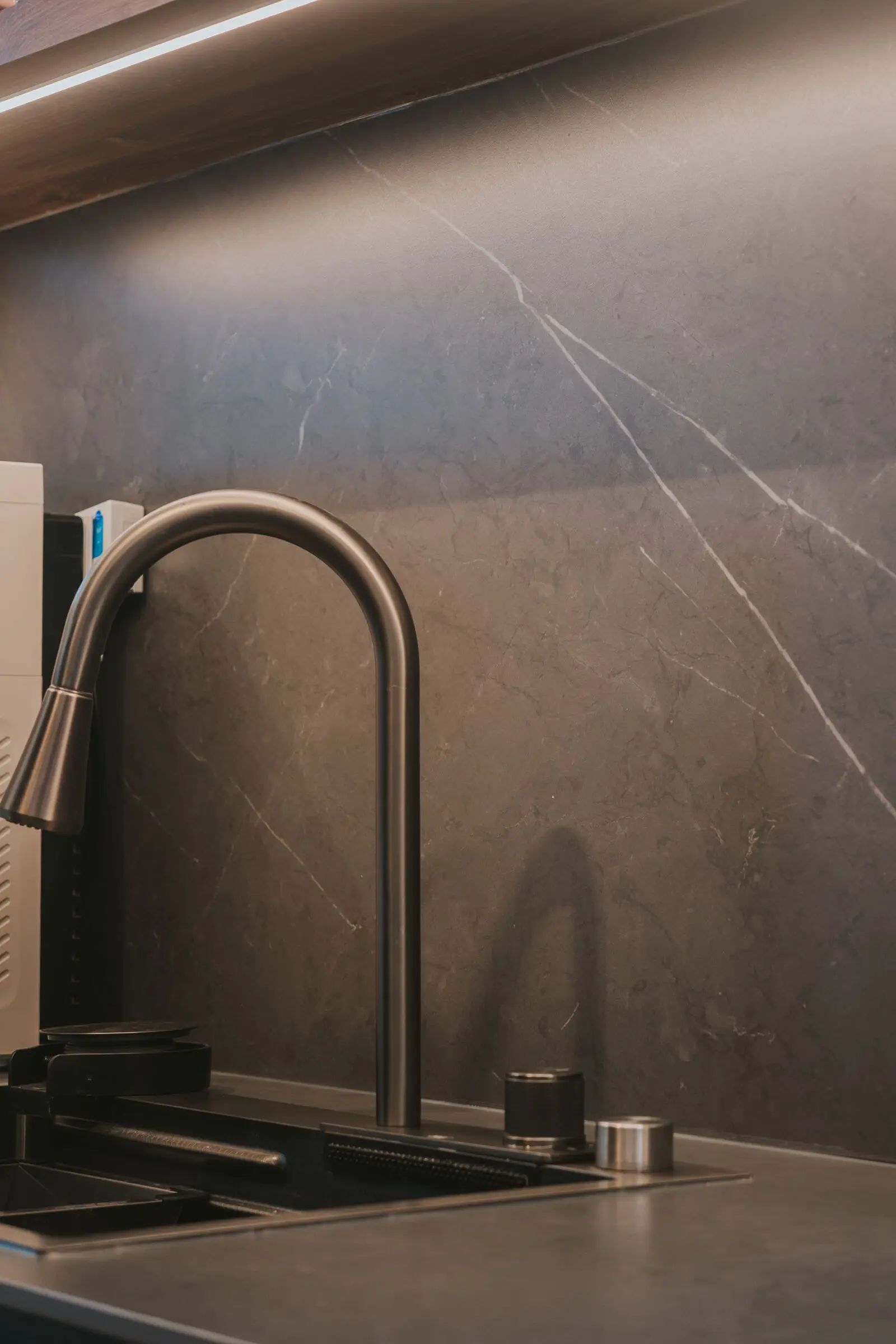 Vertical kitchen sink and backsplash detail at 213C Punggol Walk