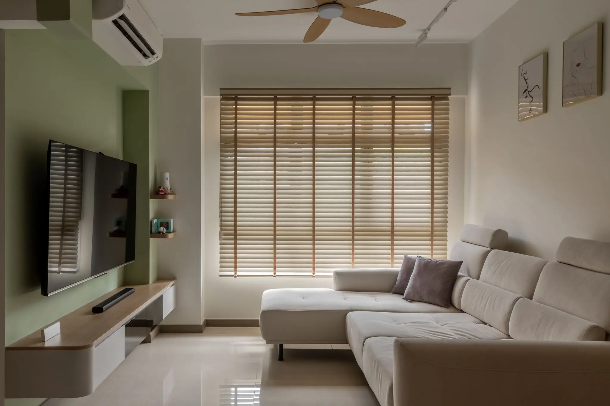 Living room with TV feature wall at 220B Tengah Garden