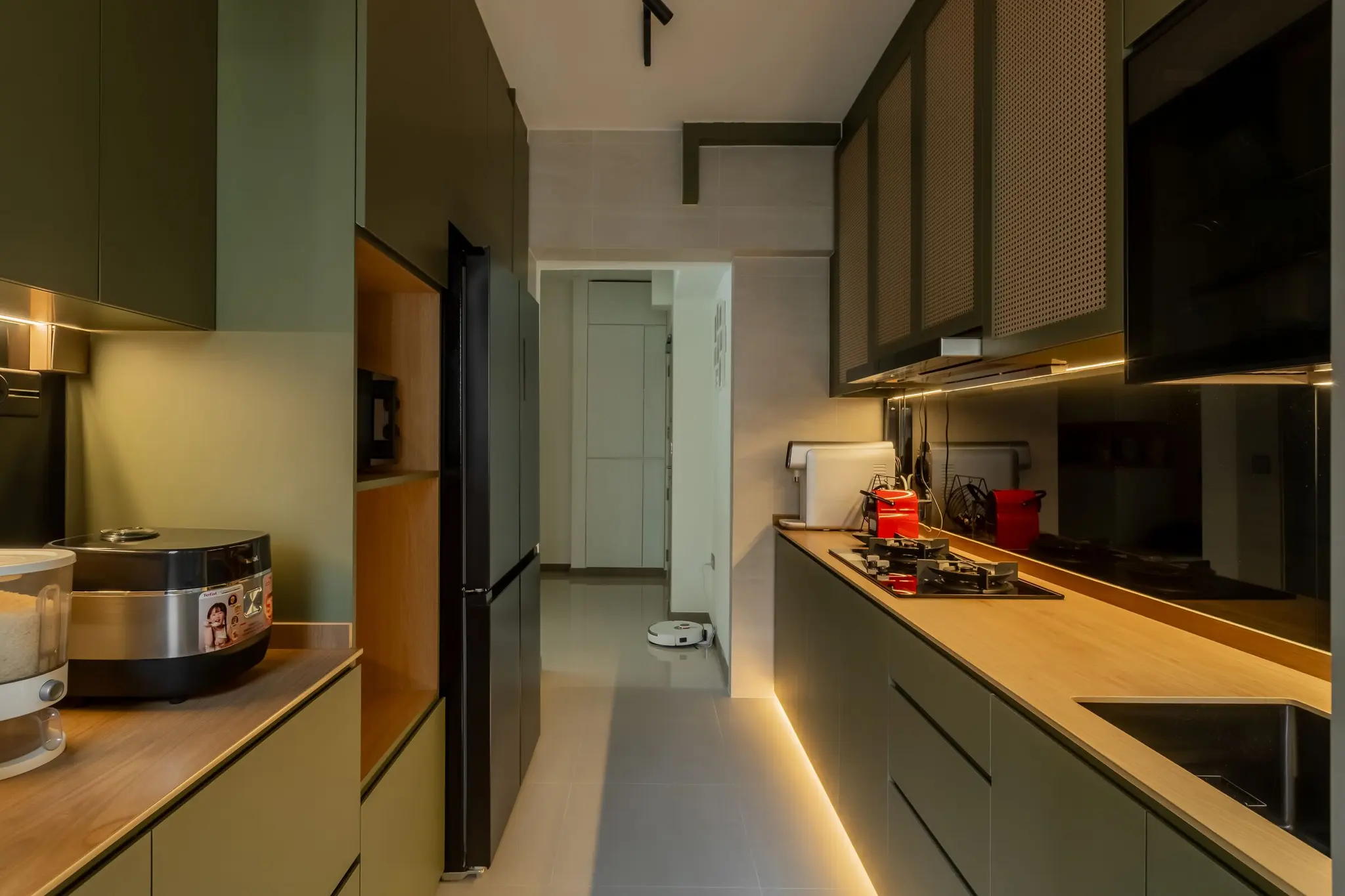 Galley kitchen with green cabinets at 220B Tengah Garden