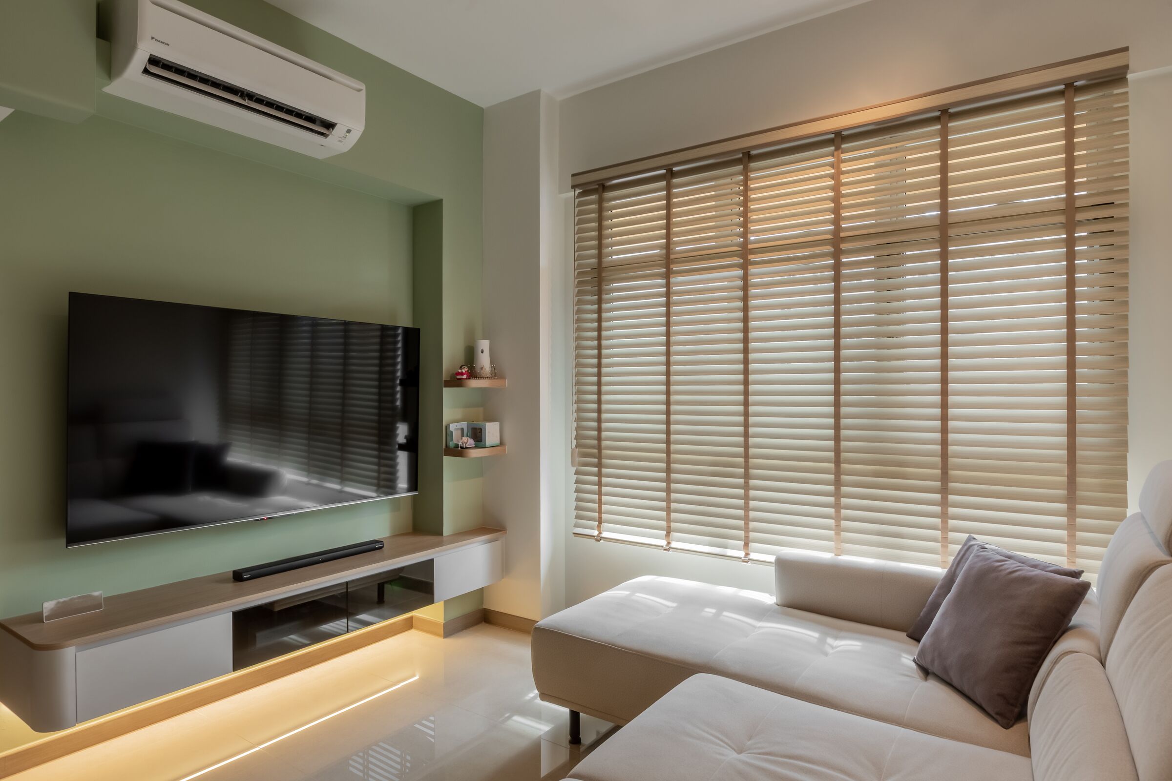 Living room with sage feature wall at 220B Tengah Garden