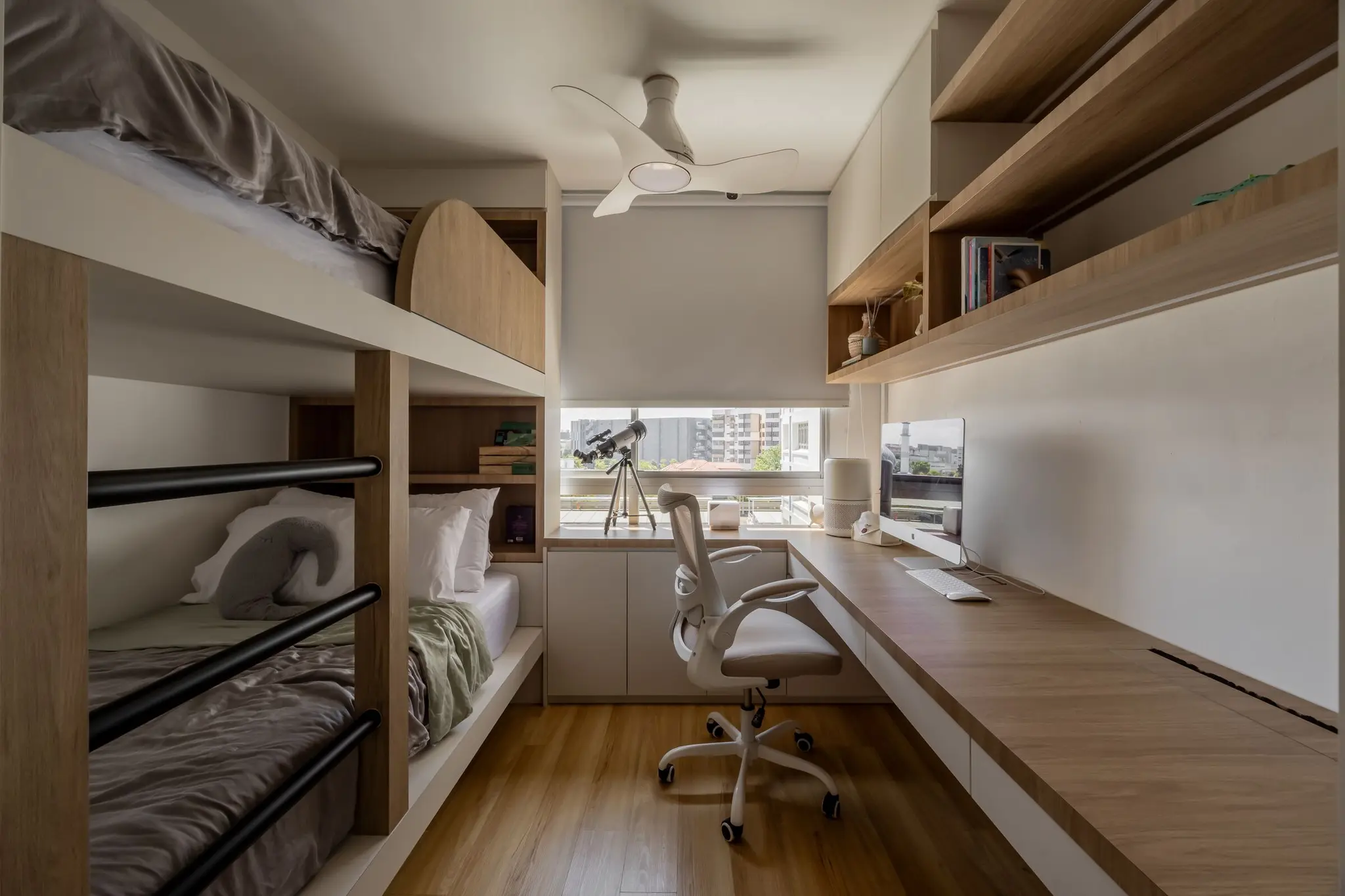 Warmly lit study area and bunk beds at 248 Pasir Ris