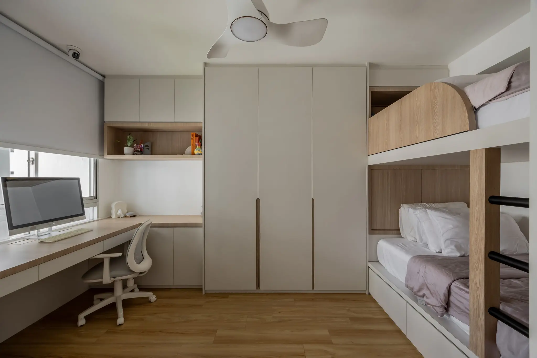 Bedroom with study desk, wardrobe, and bunk beds at 248 Pasir Ris