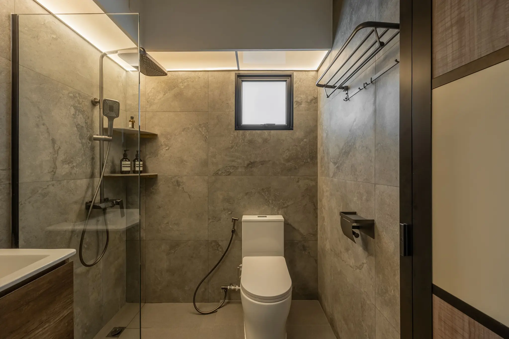Bathroom with stone-look tiles at 268C Punggol Field