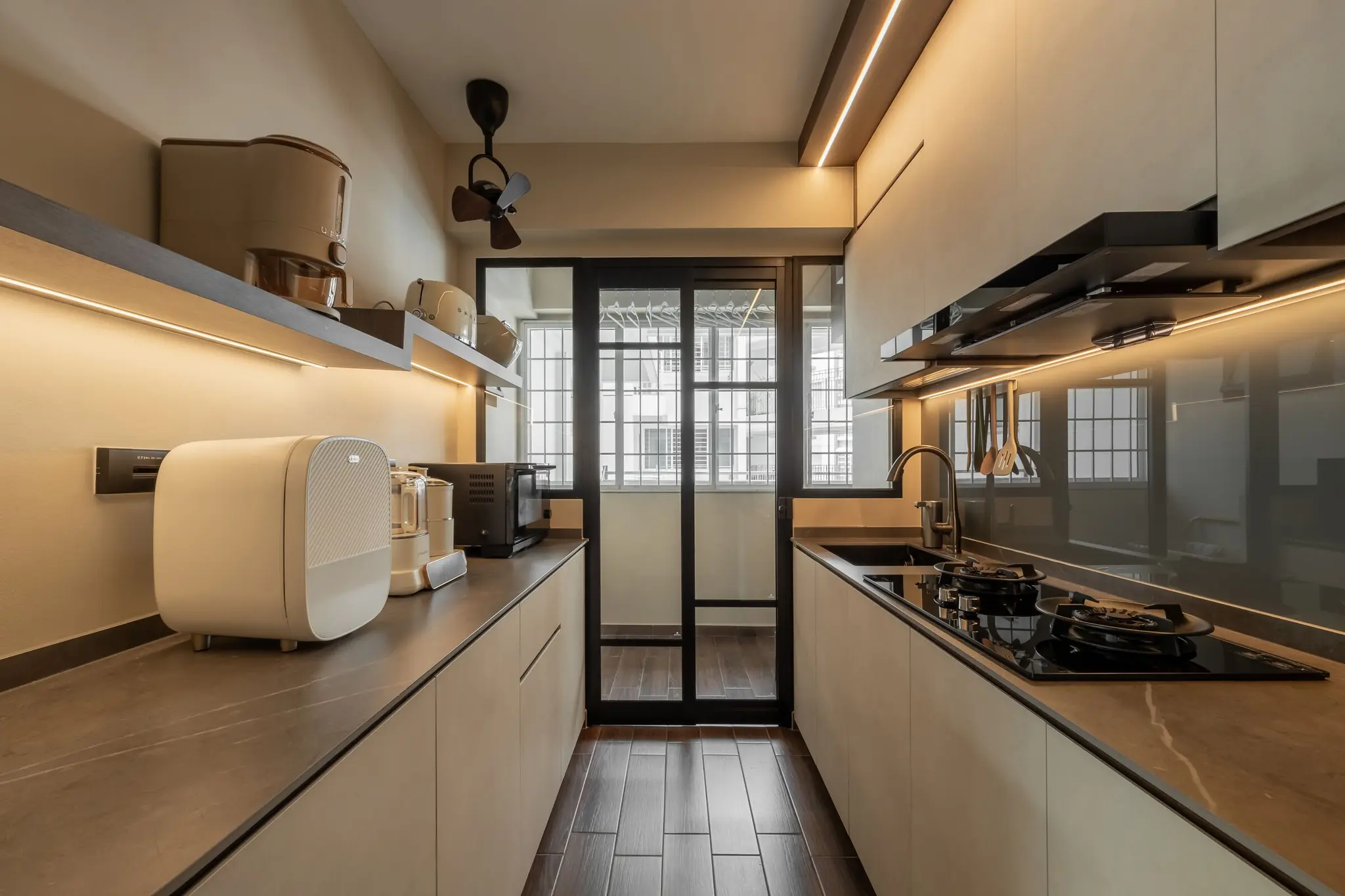 Galley kitchen with warm lighting at 268C Punggol Field
