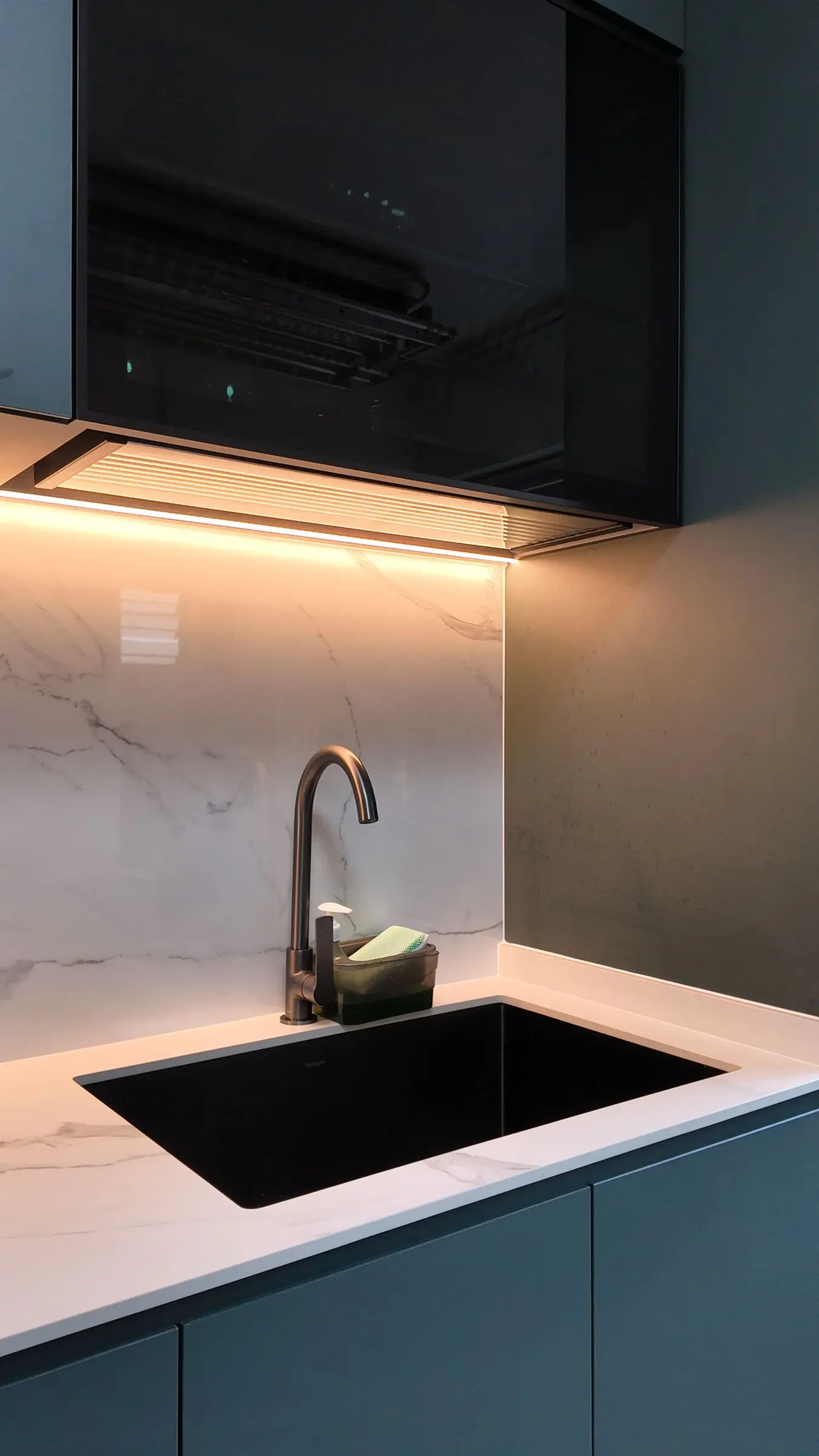 Illuminated sink and upper cabinet detail at 337 Bukit Batok