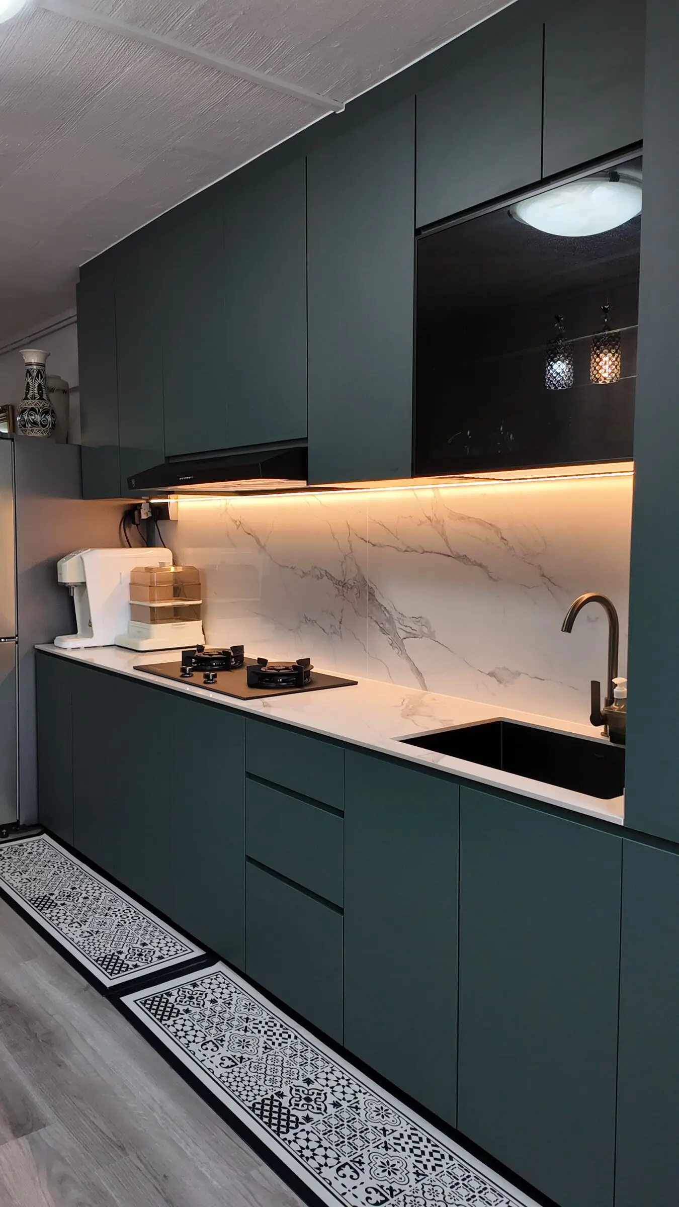 Green cabinets and marble-look surfaces at 337 Bukit Batok