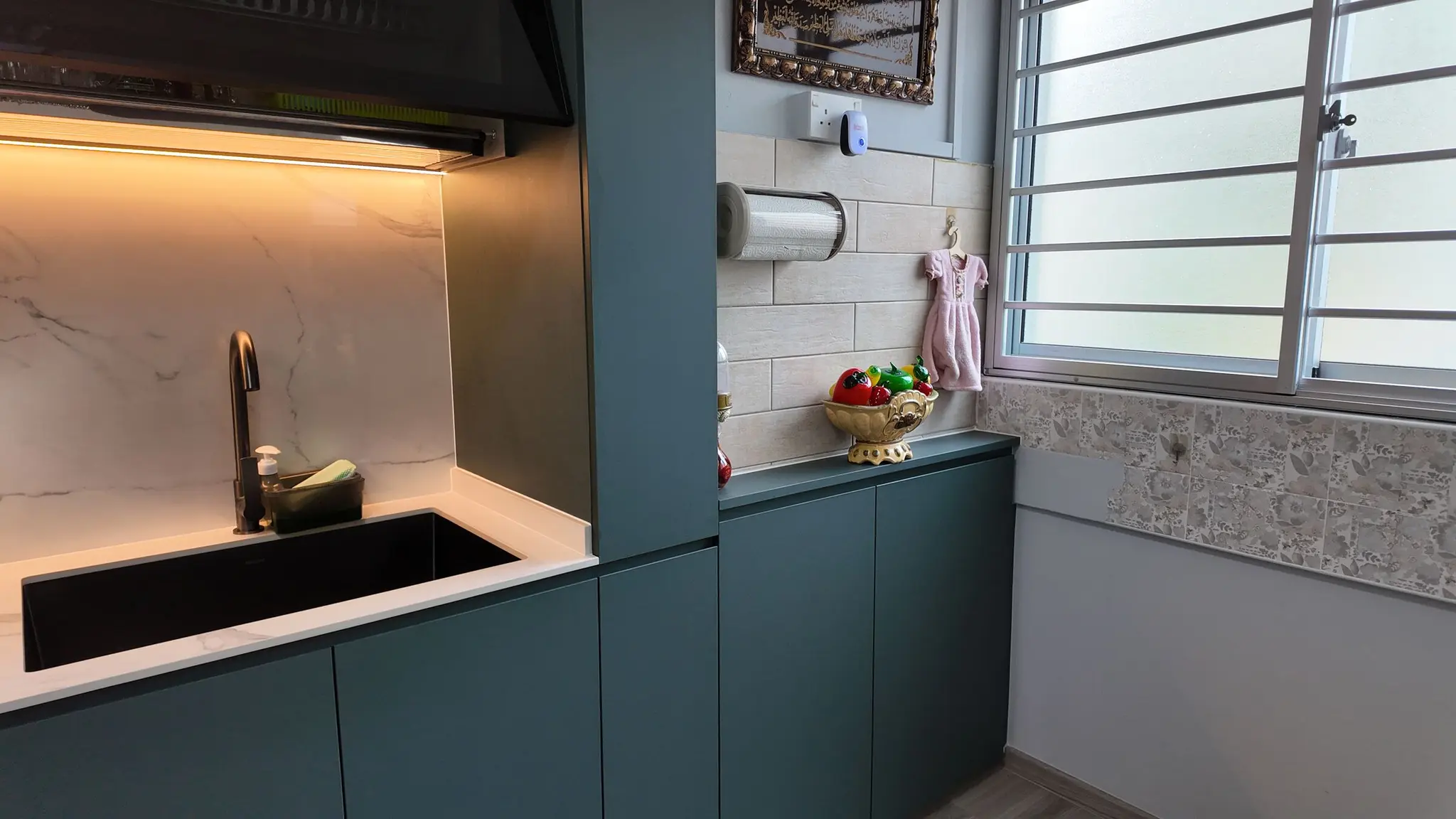 Kitchen sink and service yard cabinetry at 337 Bukit Batok