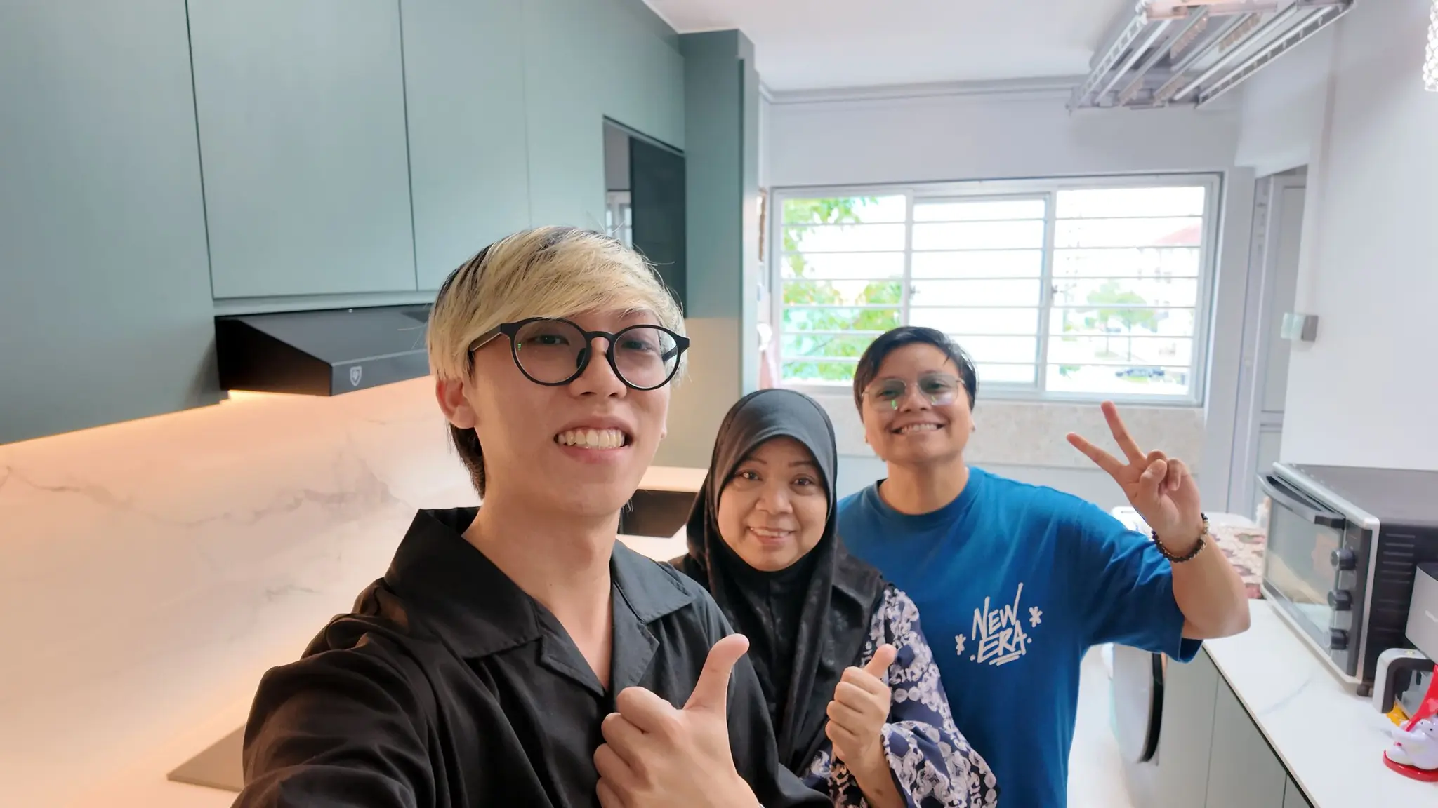 Handover selfie in the renovated kitchen at 337 Bukit Batok