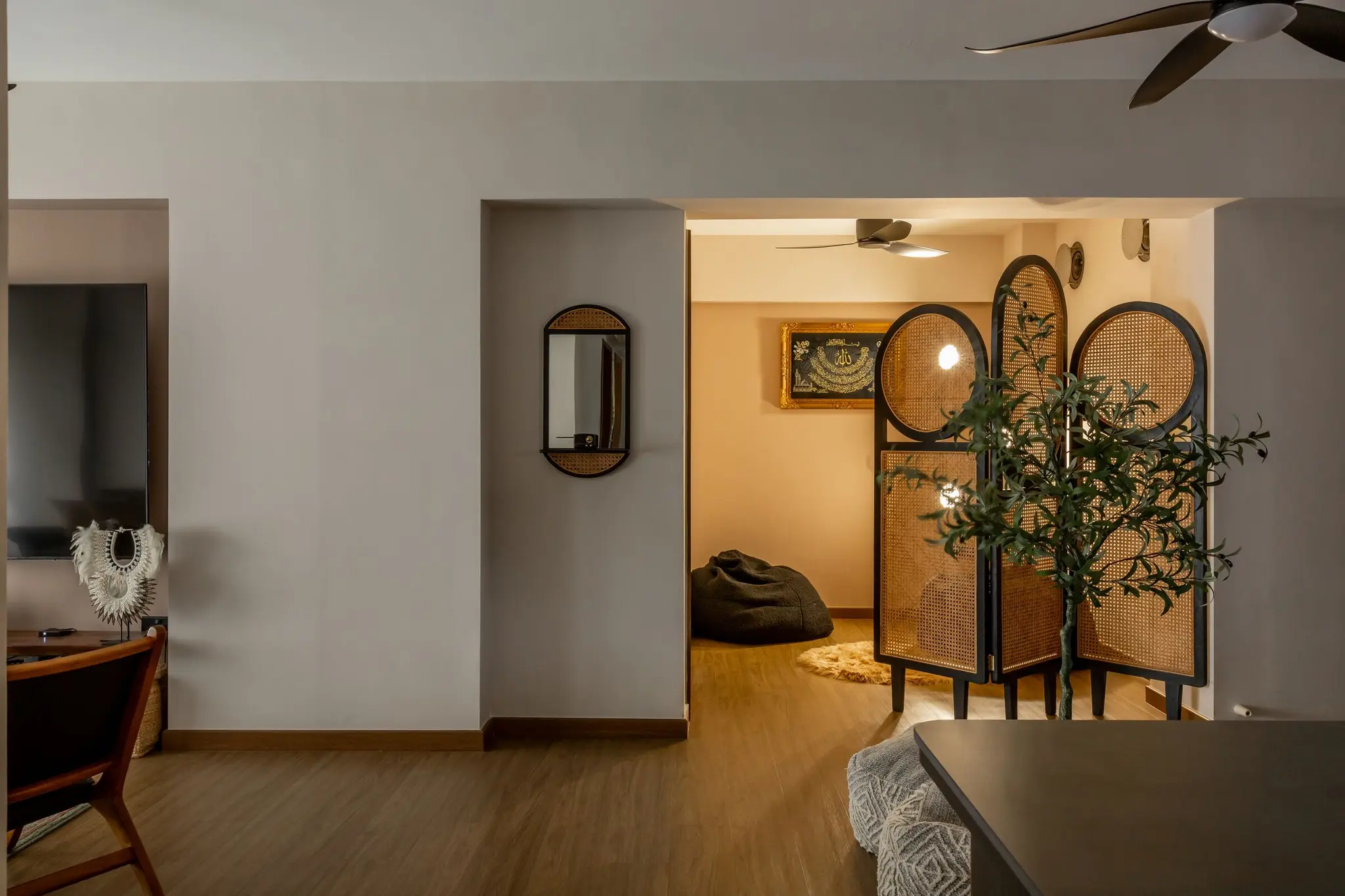 Living area with an arched rattan room divider at 401A North Shore
