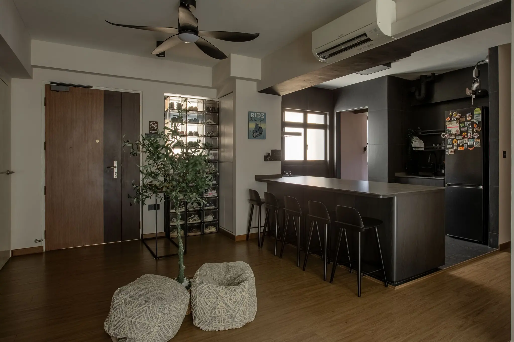 Dark kitchen island with bar seating at 401A North Shore