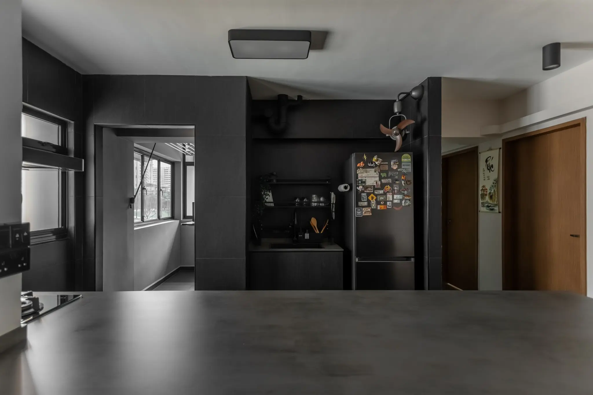 Matte black galley kitchen at 401A North Shore