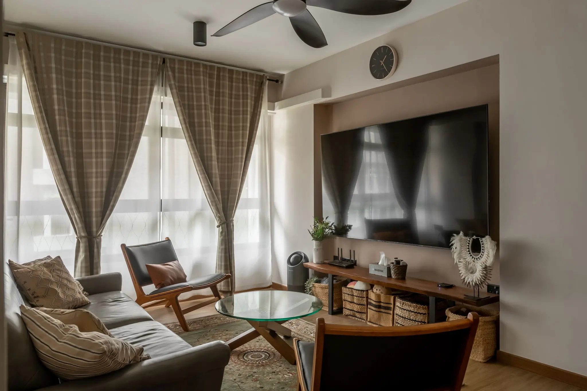 Living room with TV console and window seating at 401A North Shore