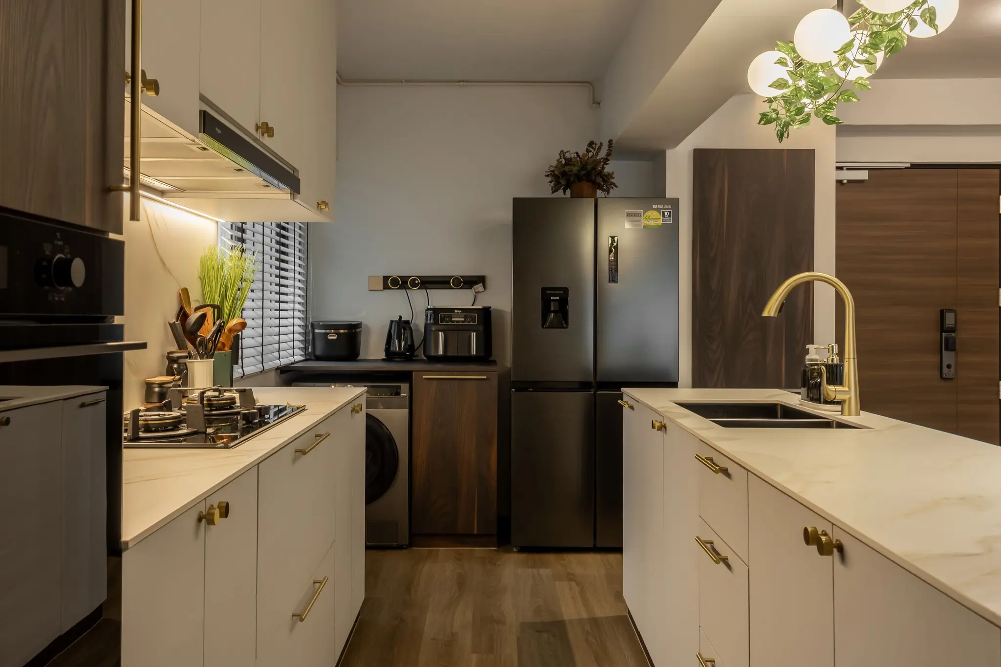 Kitchen with white cabinetry and brass accents at 405A Fernvale Lane
