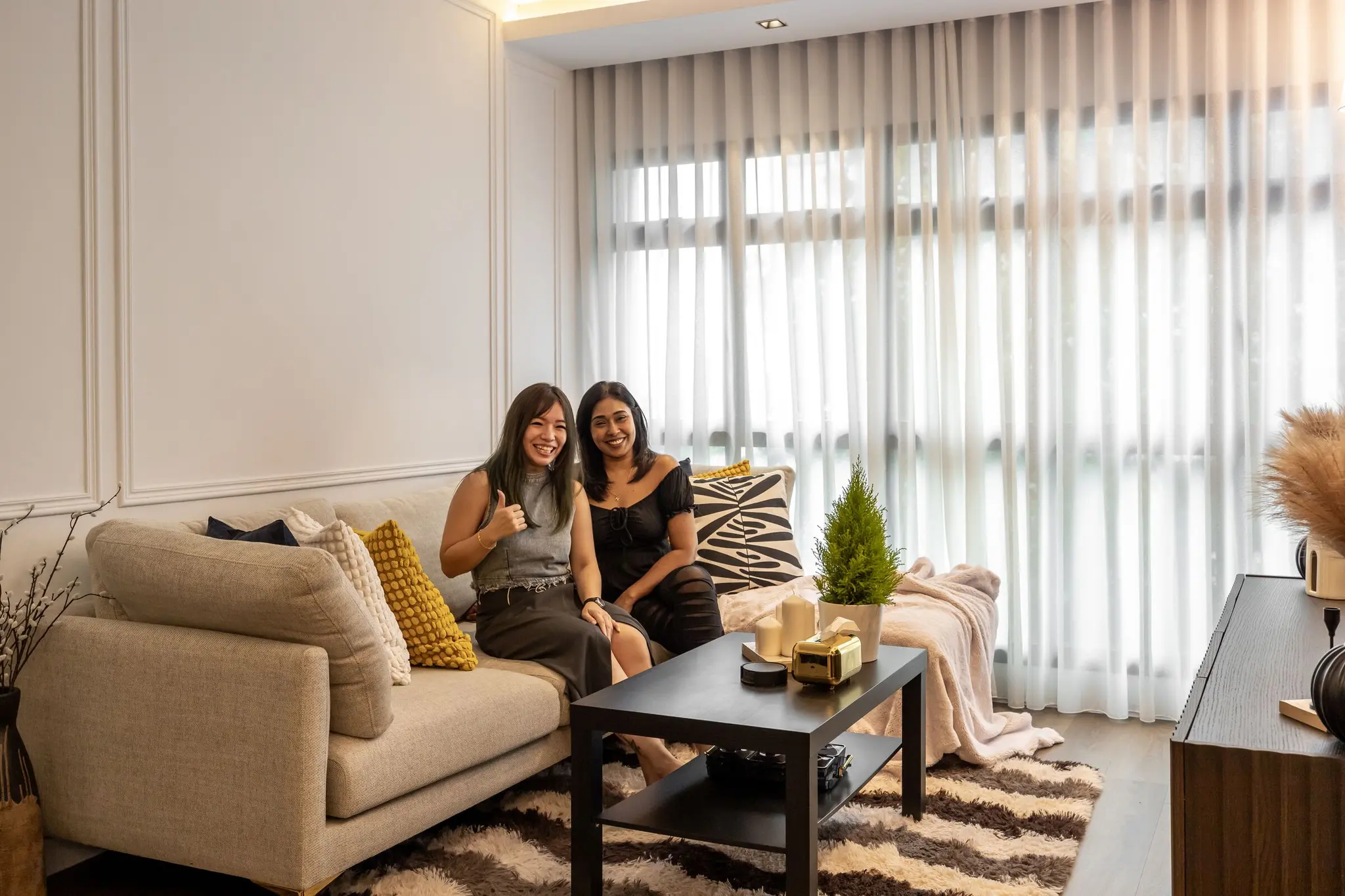 Living room with homeowners at 405A Fernvale Lane