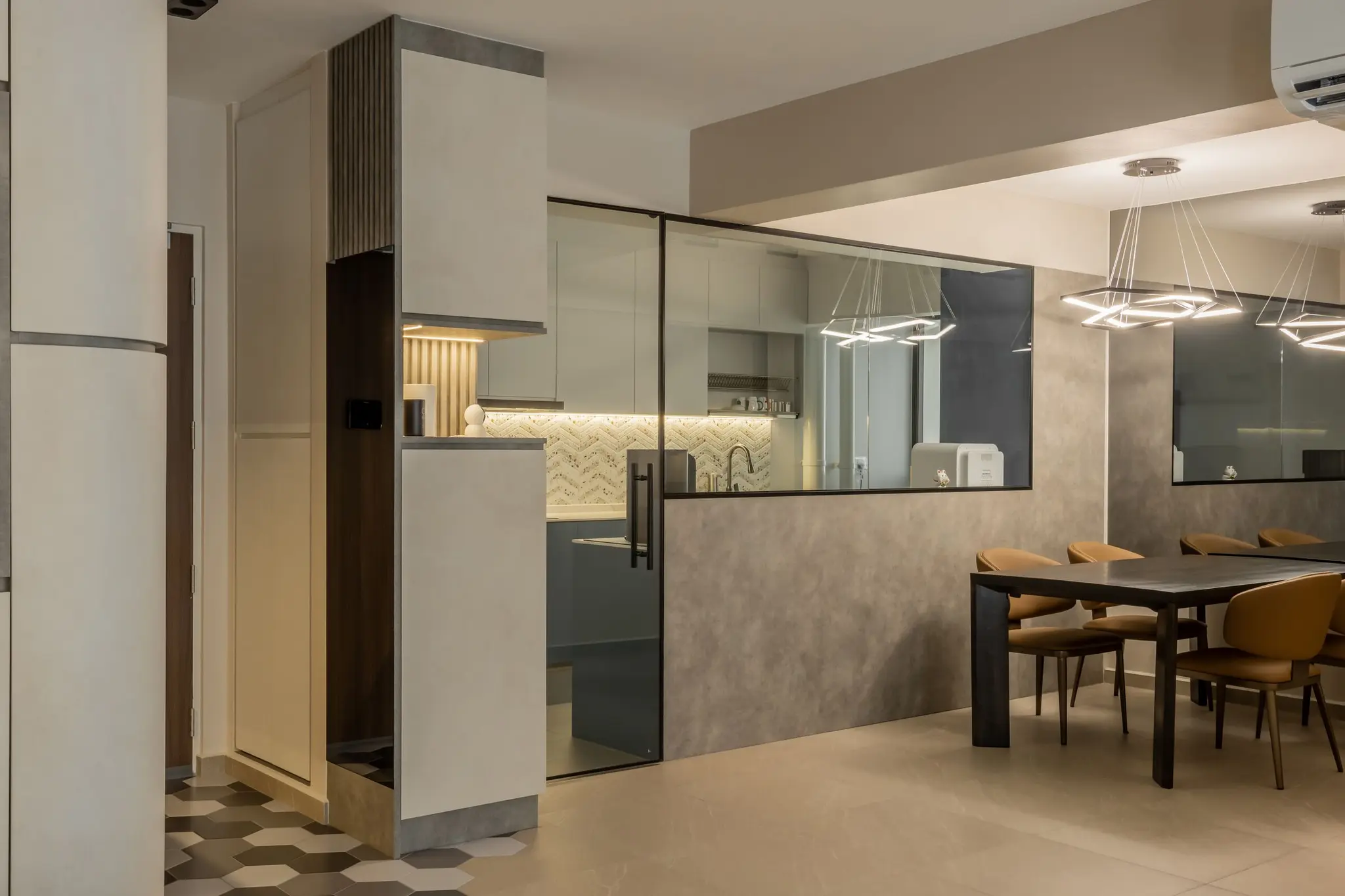 Dining area and glass-enclosed kitchen at 447A Punggol Way