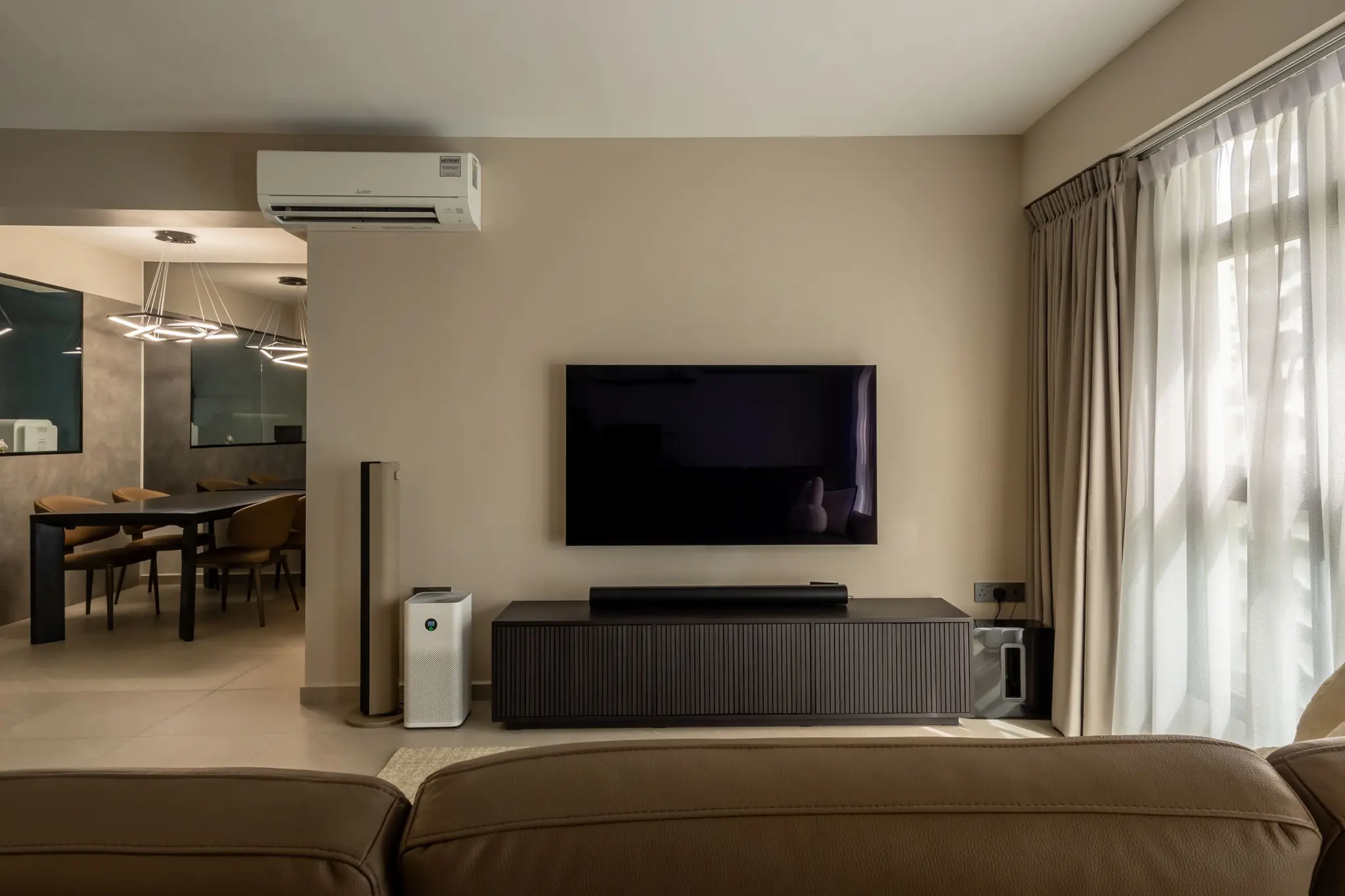 Living room TV console and dining area at 447A Punggol Way