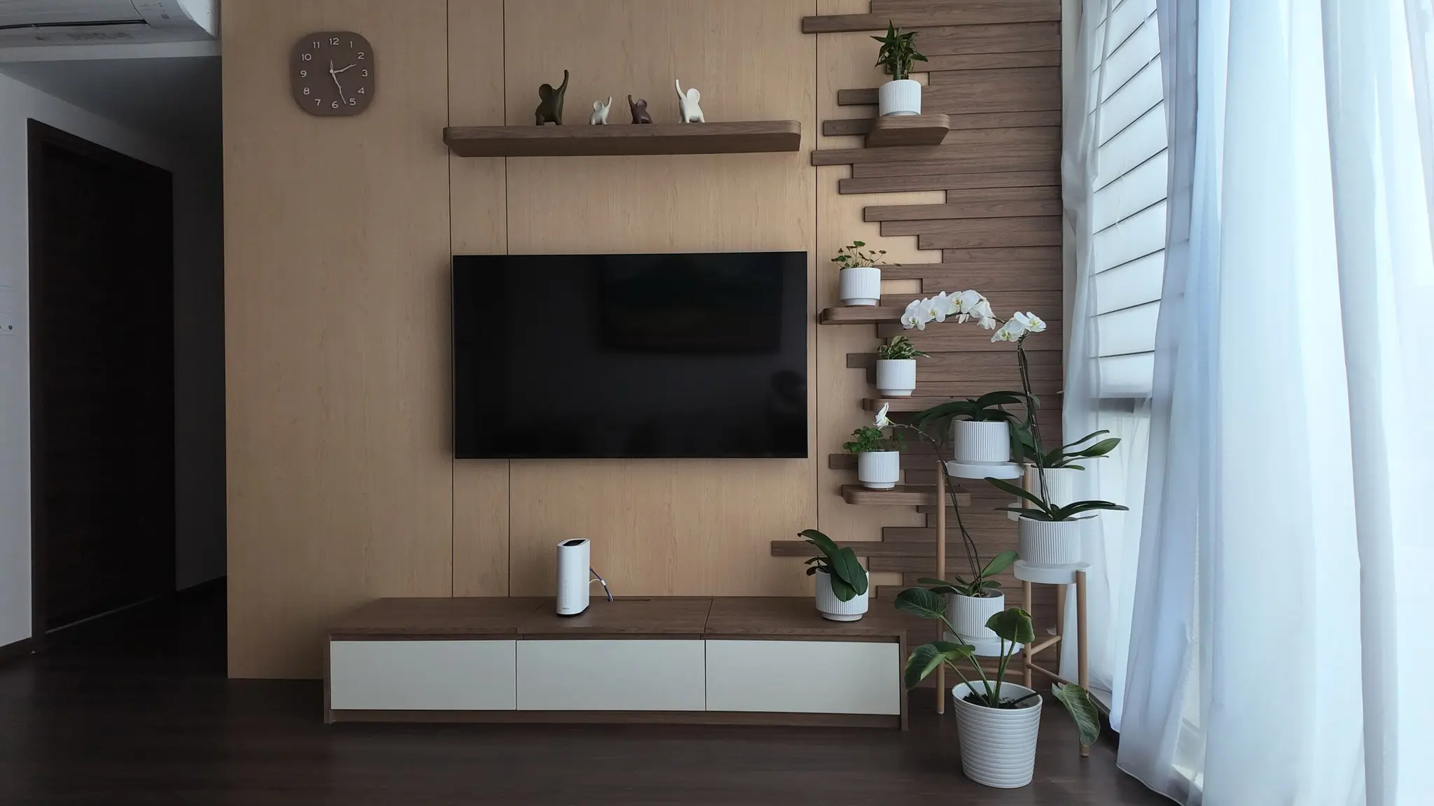 Living room wood feature wall and display shelves at Lakeshore