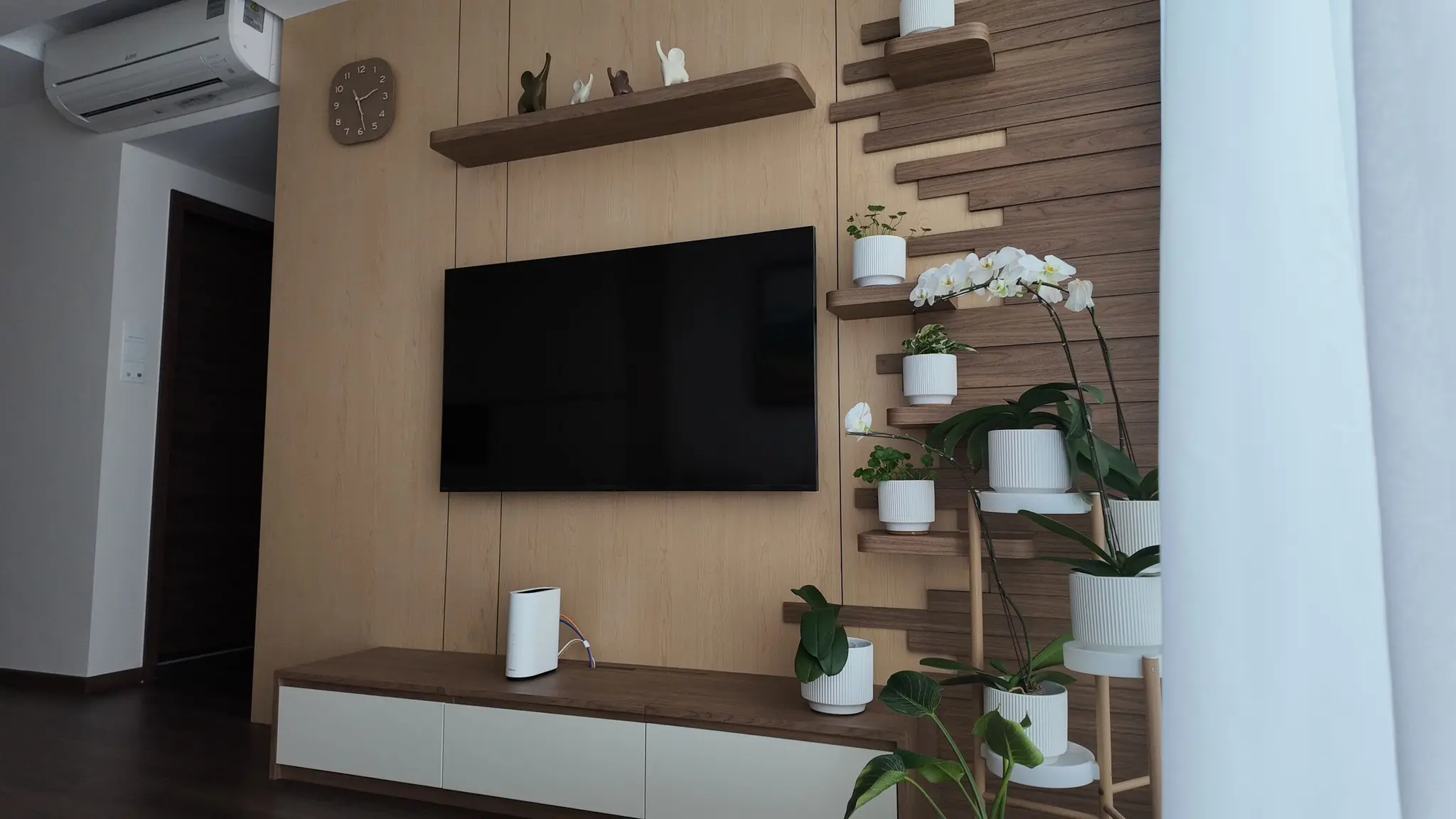 Living room seating and media wall at Lakeshore