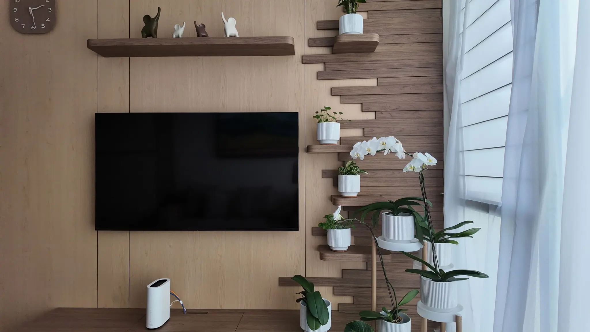 TV feature wall with integrated plant shelves at Lakeshore