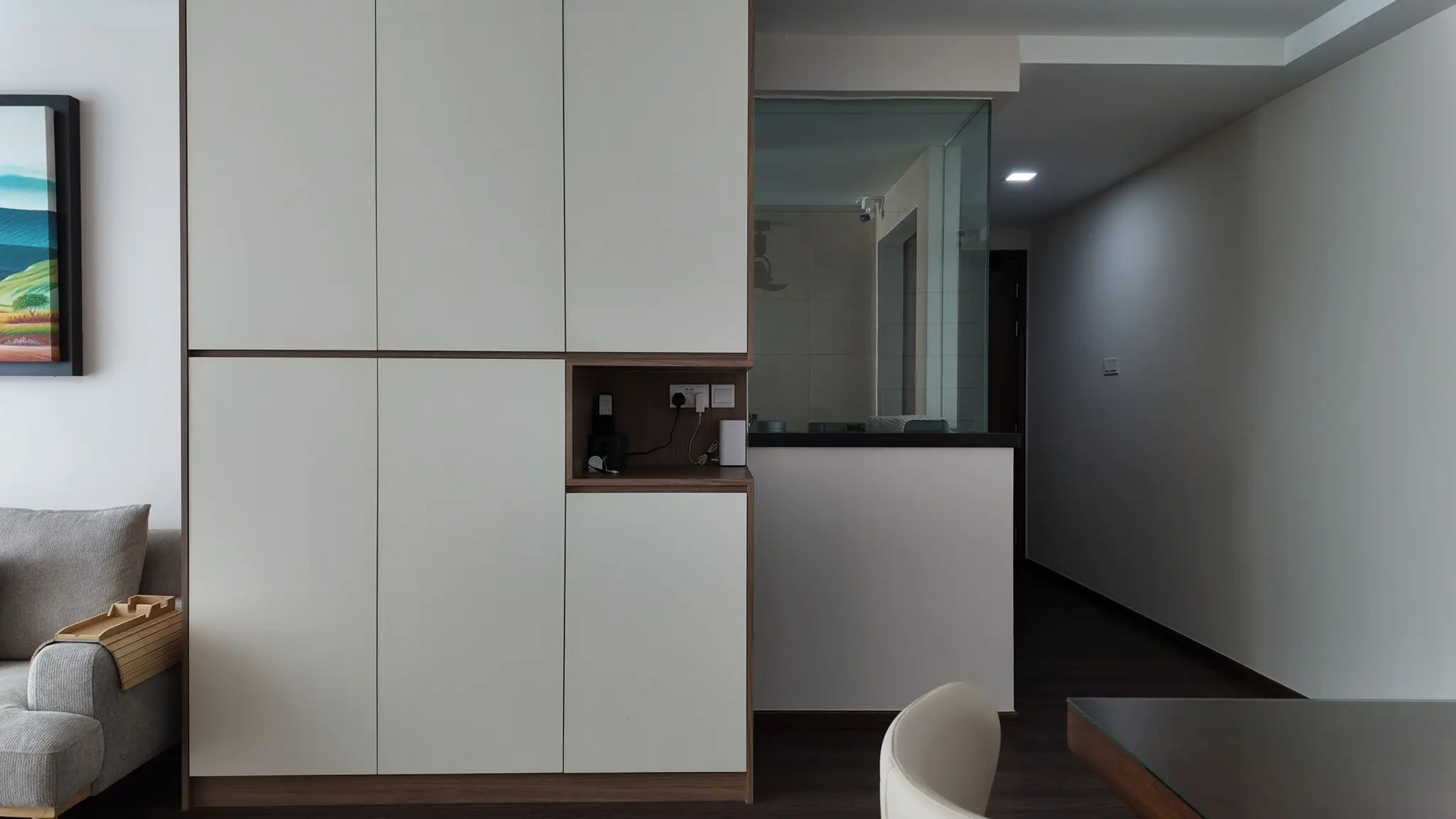 Living room storage wall and hallway at Lakeshore