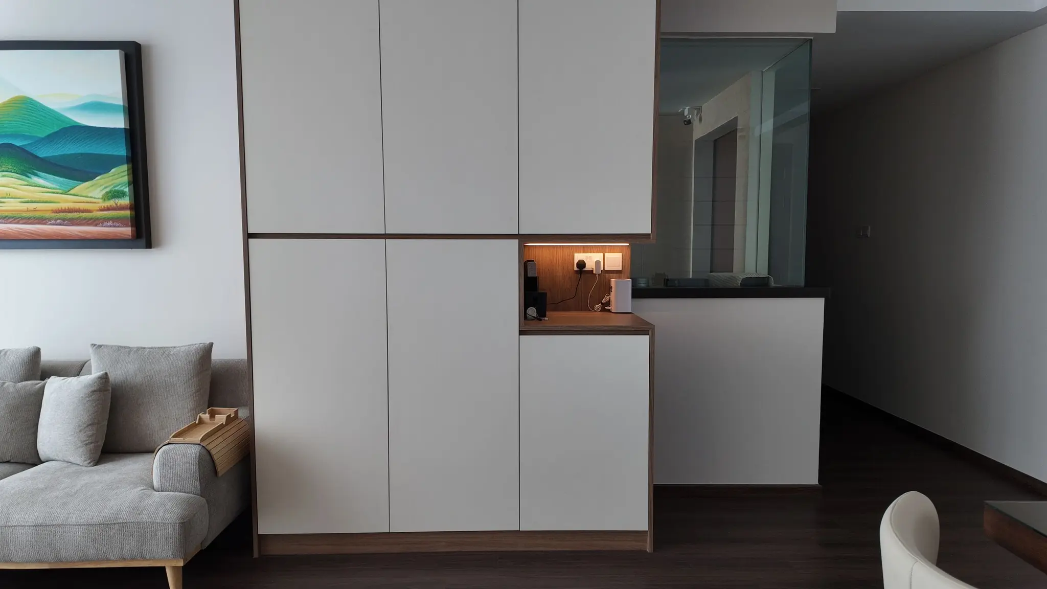Living room storage with illuminated charging niche at Lakeshore